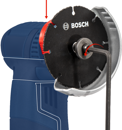 Hex key tightening a circular saw blade on a power tool.