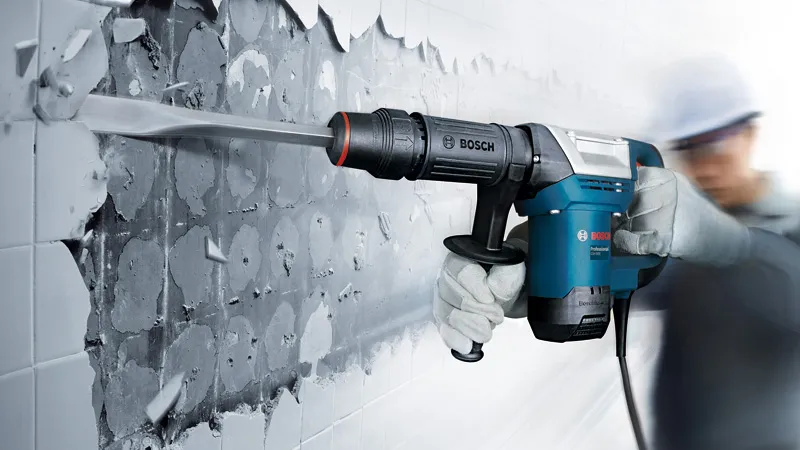 Bosch GSH 500 demolition hammer breaking wall tiles.