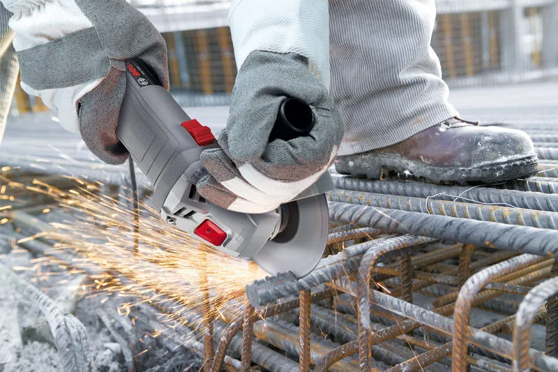 Bosch WS700 angle grinder cutting steel rebar.